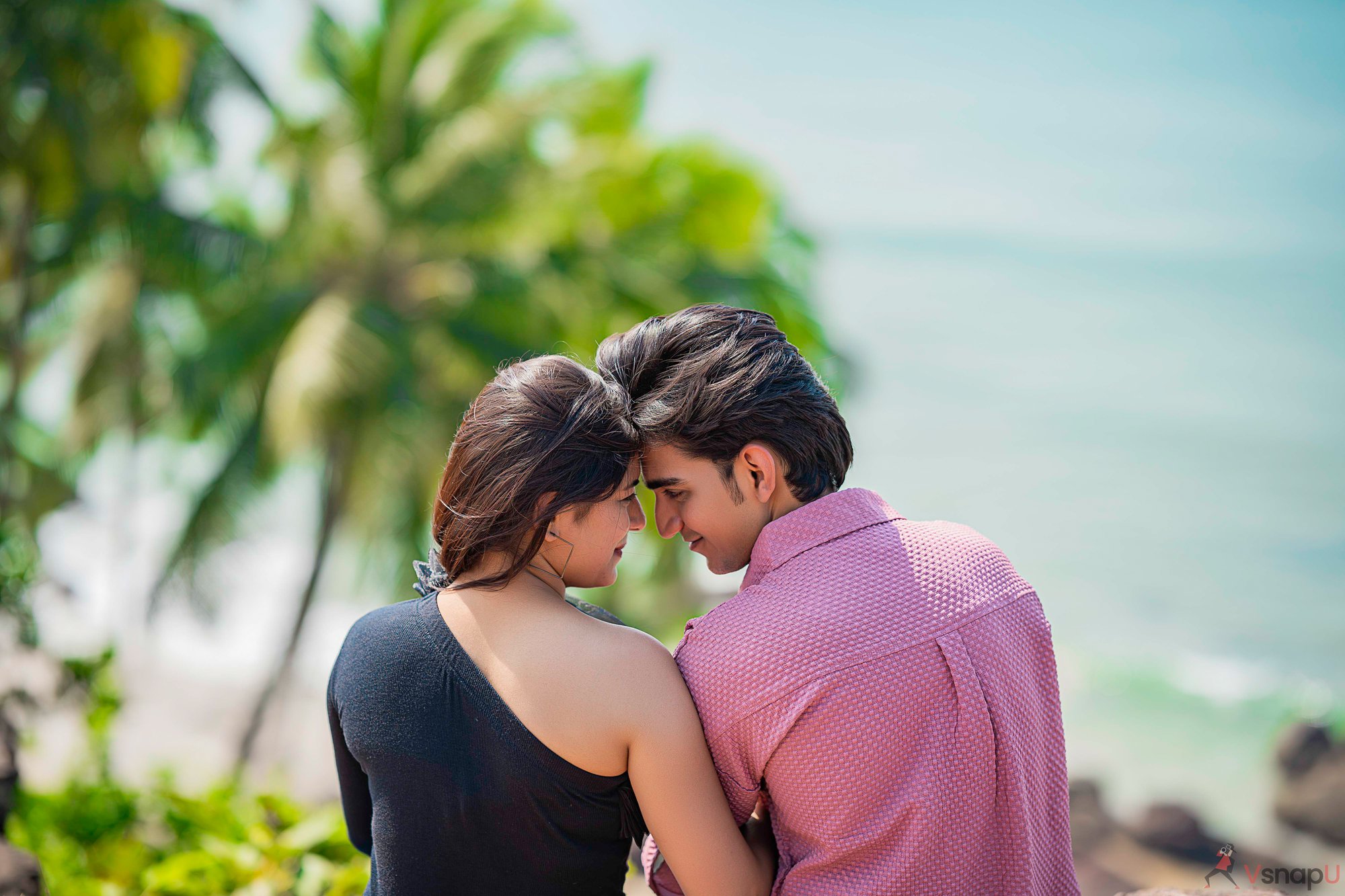 Couple captured in love during beachside photoshoot with nature